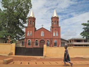 Child walking by a church
